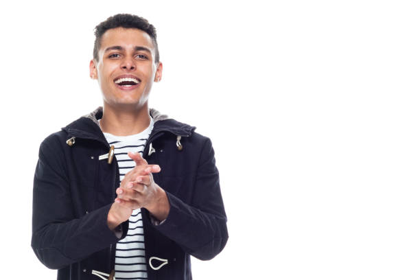istock Handsome black man with curly hair and wearing a jacket - clapping 1153648081