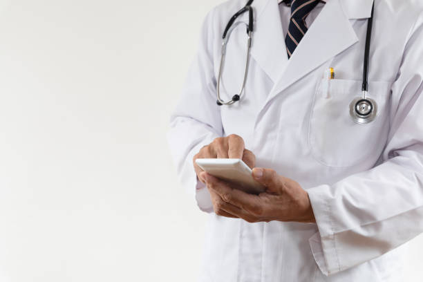 istock Doctor searching on smartphone 1153649774