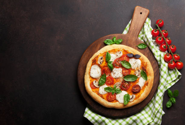 istock Italian pizza with tomatoes, mozzarella and basil 1153651040
