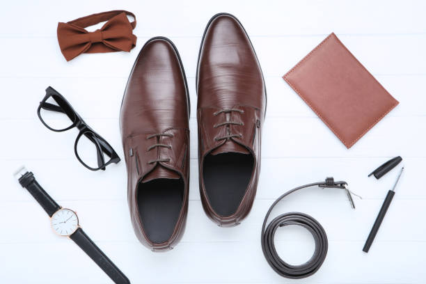 istock Male leather shoes with accessories on white background 1153651417