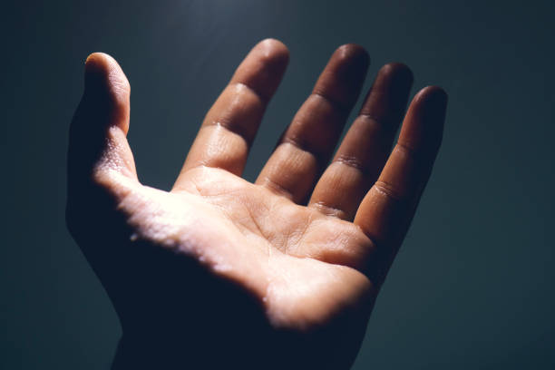 istock Light in human hand in the dark, miracle concept 1153652560