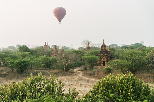 Scenic view of hot air balloons above  Bagan Heritage Site at sunrise