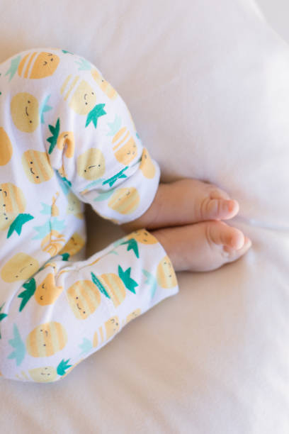 istock Pineapple Pants on Baby Legs 1153656172