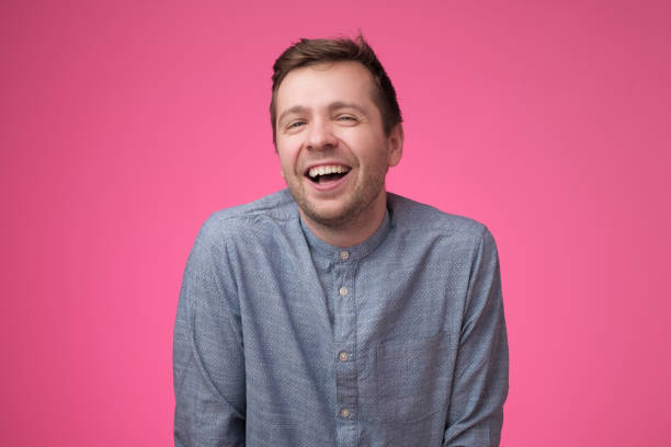 istock European young man laughing on funny joke 1153656180