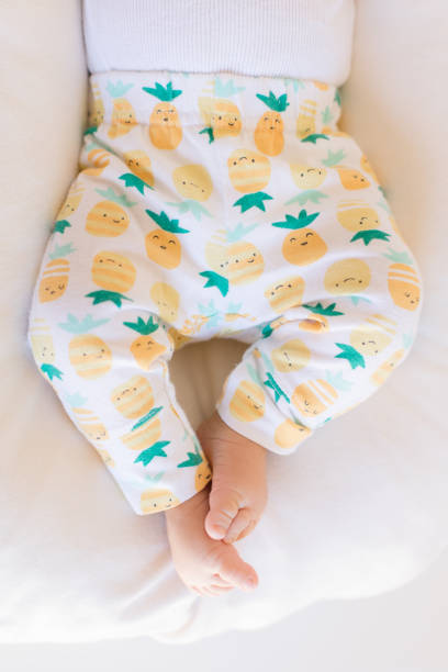 istock Pineapple Pants on Baby Legs 1153656279