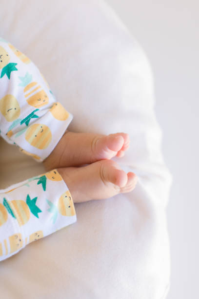 istock Pineapple Pants on Baby Legs 1153656282