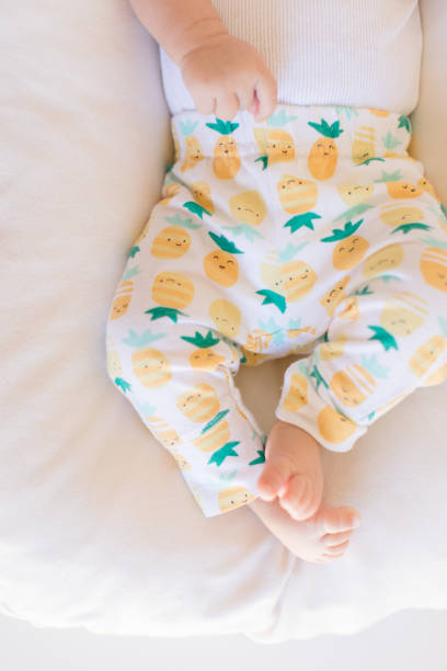 istock Pineapple Pants on Baby Legs 1153656574