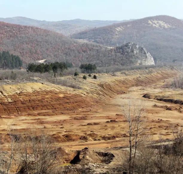 Deposits, The old tailings Trepca's in Zvecan, Canyon in Kosovo"nnext to Duda's karst, in the background the road leading to Vlajna village