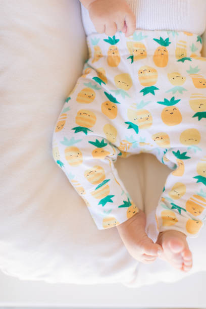 istock Pineapple Pants on Baby Legs 1153657157