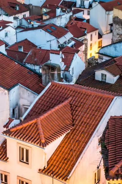 Photo of Closeup view of red tile rooftops in Alfama Lisbon