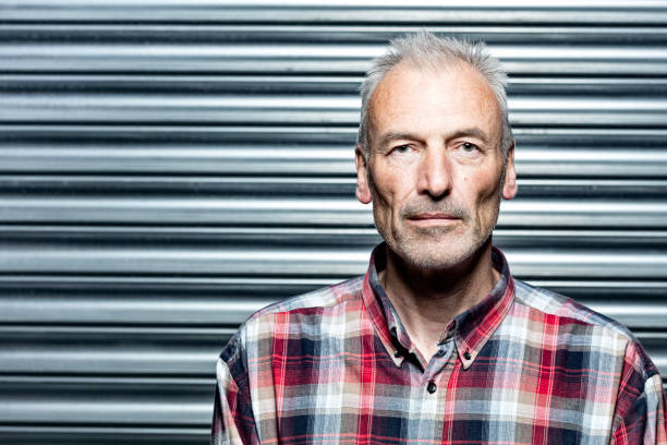 istock Middle-aged man wearing a checked shirt 1153658830