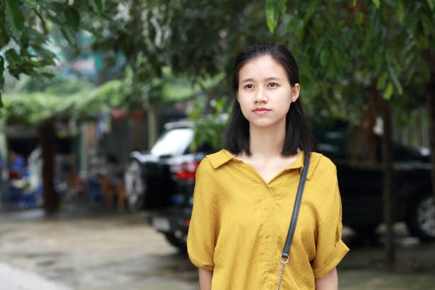 istock woman with umbrella in the town 1153661748