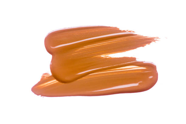 istock Texture of deep brown liquid foundation.Liquid foundation smudges isolated on white background. 1153661793