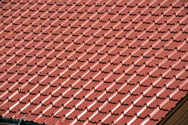 istock Background and texture, architectural details,brown ceramic roof tiles in seamless diagonal pattern on sunny day. 1153664656