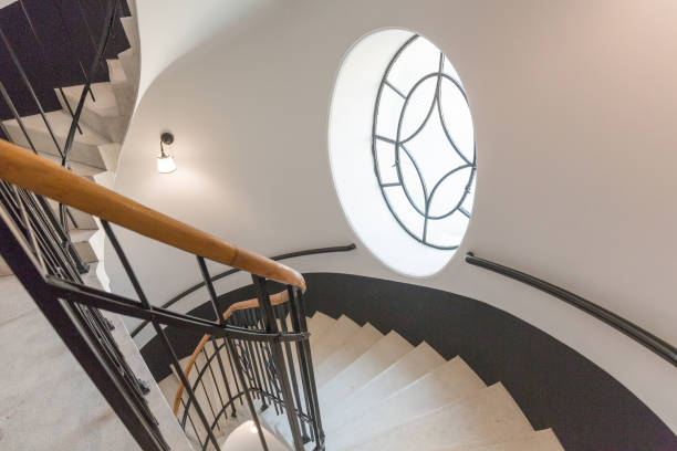 istock High angle view of spiral staircase winding downward 1153665728
