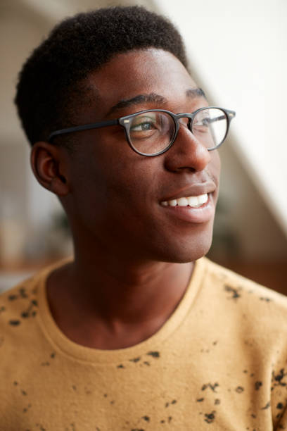 istock Young Man Wearing Glasses In Loft Apartment 1153667422