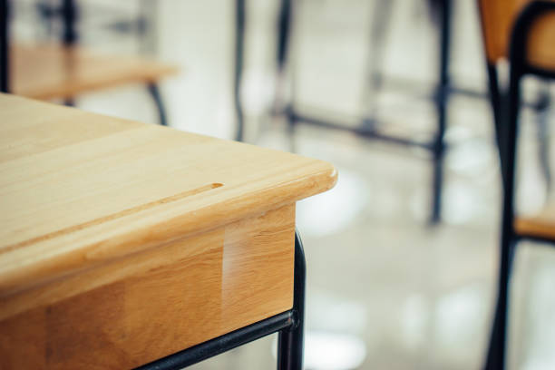 istock Back to school concept. School empty classroom, Lecture room with desks and chairs iron wood for studying lessons in highschool thailand without young student, interior of secondary education 1153668096