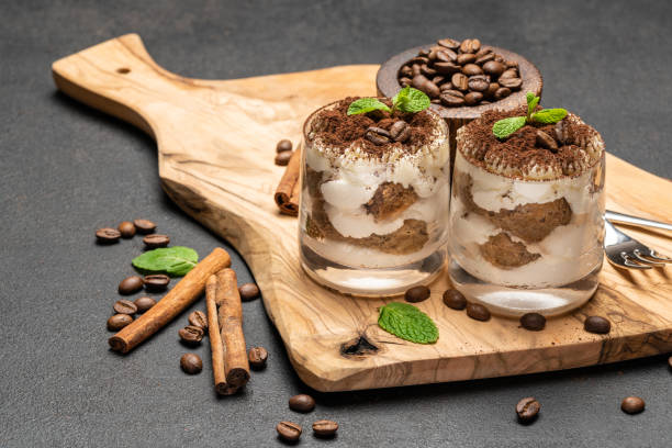 istock Classic tiramisu dessert in a glass on dark concrete background 1153671008