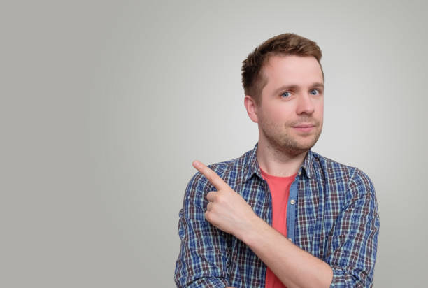 istock Caucasian man with  finger point aside 1153671457