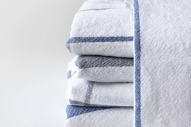 istock Kitchen towels folded on white background with copy space, close-up 1153672417
