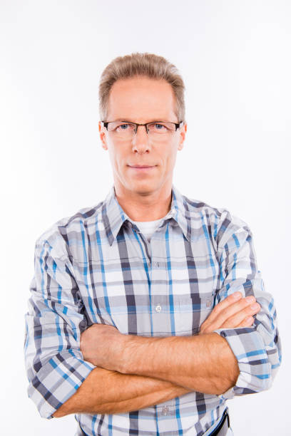 istock Confident happy aged man in glasses crossing hands 1153673978