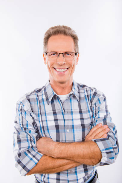 istock Confident happy aged man in glasses crossing hands 1153674003