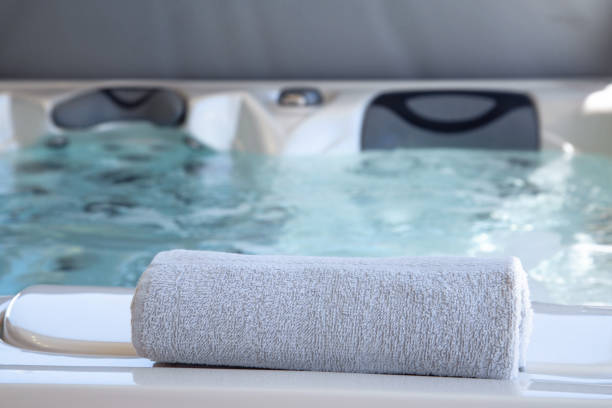 istock bath towel placed on the edge of a therapeutic spa 1153674371