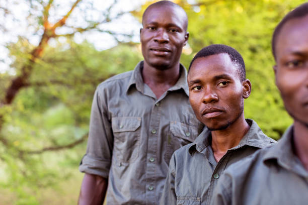 istock Group of African Forest Rangers Facing the Camera for a Portrait 1153674519