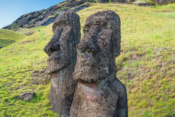 Easter Island Two Moai Statues side by side at Rano Raraku. Rano Raraku, Rapa Nui National Park, Hanga Roa, Easter Island, Chile.