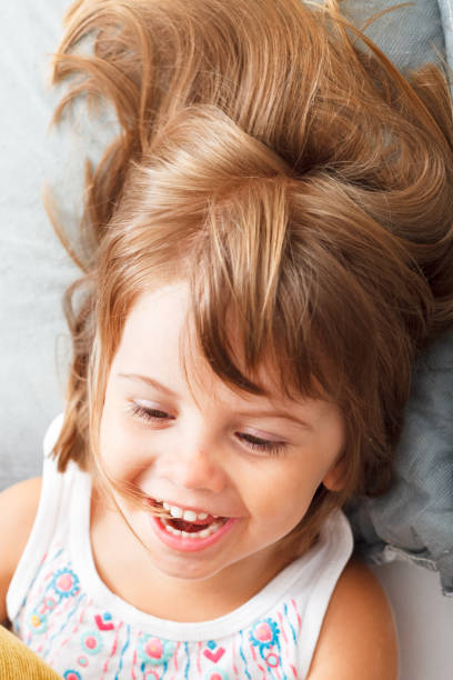 istock Adorable little girl laughing 1153676146