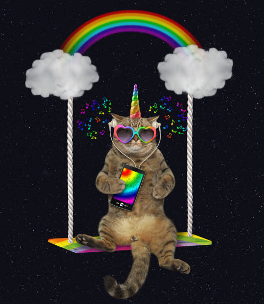 istock Cat unicorn with a phone swinging 1153676812