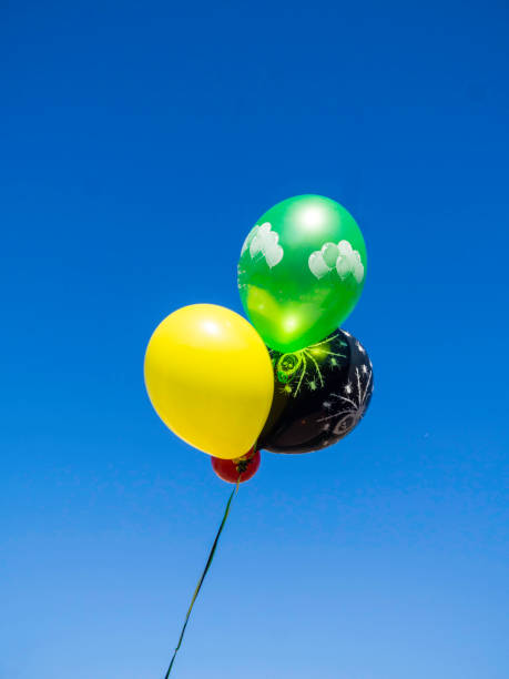 istock image of colorful balloons with sky background 1153678106