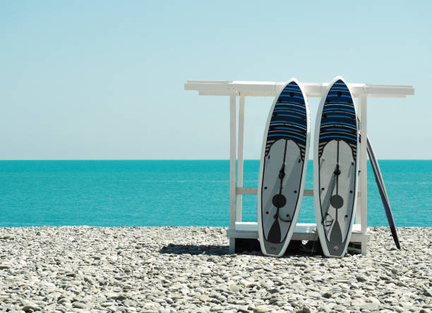 istock Stand-up paddleboard for SUP surfing on beach 1153684832