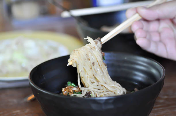 istock eating noodle, Chinese noodle 1153685819