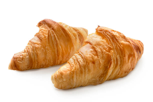 istock Two baked plain croissants isolated on white. 1153687551