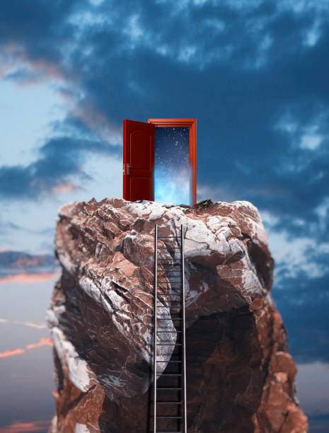 istock Ladder on mountain peak with a opened door to space. 1153687858