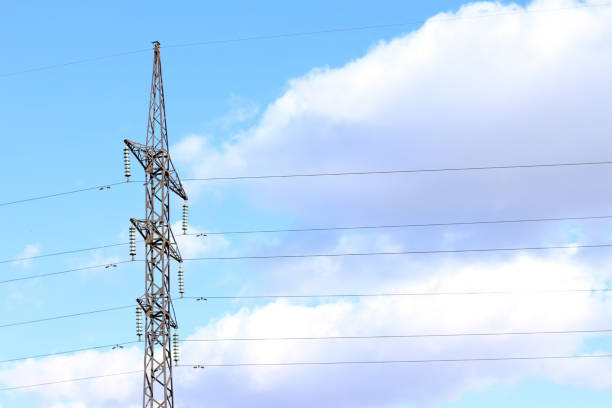 istock Power line against the blue sky with clouds power station wire 1153689016