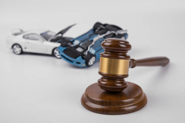 hammer of the judge. two collided cars on a white background. - employment issues law gavel legal system imagens e fotografias de stock