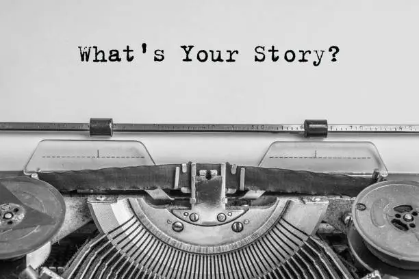 Photo of what's your story? The text is typed on paper with an old typewriter