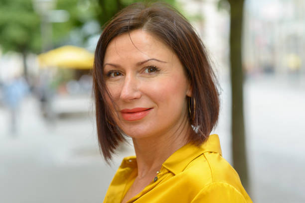 istock Smiling woman scrutinising the camera 1153690373