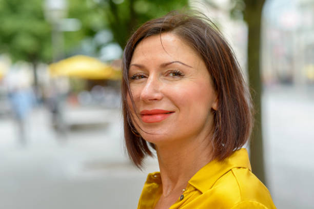 istock Smiling woman scrutinising the camera 1153690810