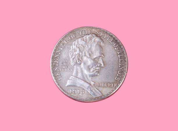 istock half dollar coin isolated on pink background 1153690936