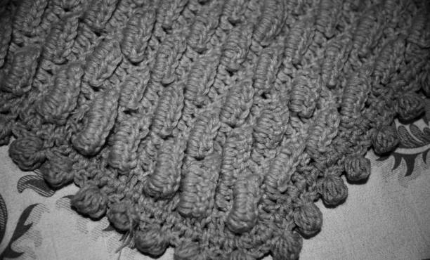 Black and white horizontal stripes - crocheted texture background, concept of contrast in life, ups and downs. Black and white streaks in life. Handmade background