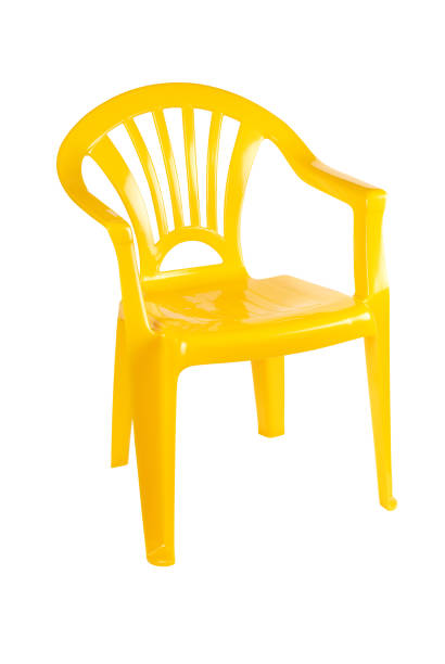 istock Bright yellow plastic chair, isolated on white with clipping path 1153695112