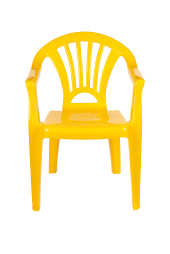 Yellow plastic chair isolated on white with path