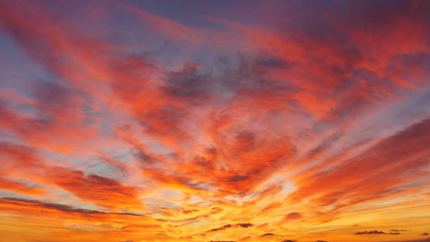 istock beautiful cloudscape at sunset with red clouds on sky 1153695241