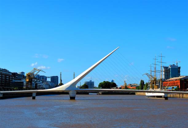 Puerto Madero waterfront and the Woman´s Bridge. Buenos Aires, Argentina - March 29, 2018. View of Puerto Madero waterfront and the Woman´s Bridge. Buenos Aires cityscape. puente de la mujer stock pictures, royalty-free photos & images