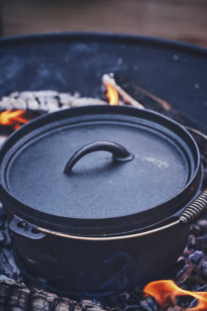 istock Cooking Chili Con Carne in Dutch Oven over Logfire 1153699821
