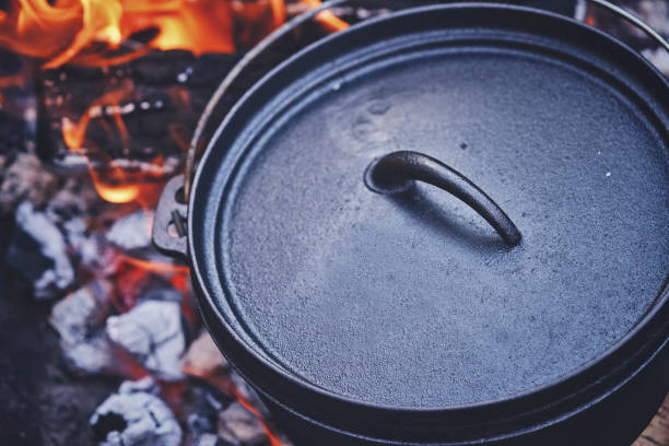 istock Cooking Chili Con Carne in Dutch Oven over Logfire 1153699823