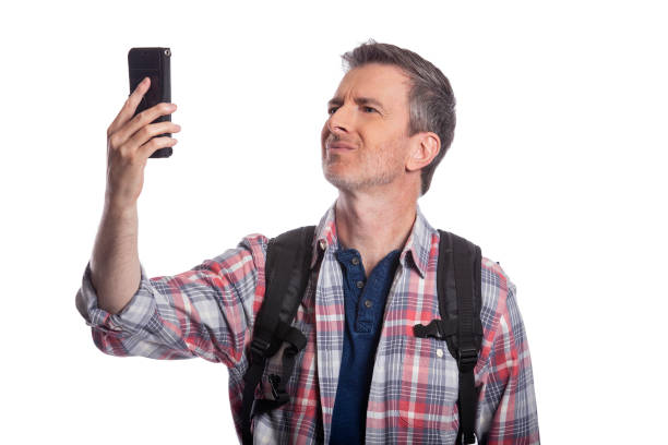 Tourist With No Cell Phone Service or Network Tourist or traveling hiker unable to get cellphone reception or network.  The man can't make a call or get a rideshare because he has no service or internet. Isolated on a white background. no signal stock pictures, royalty-free photos & images